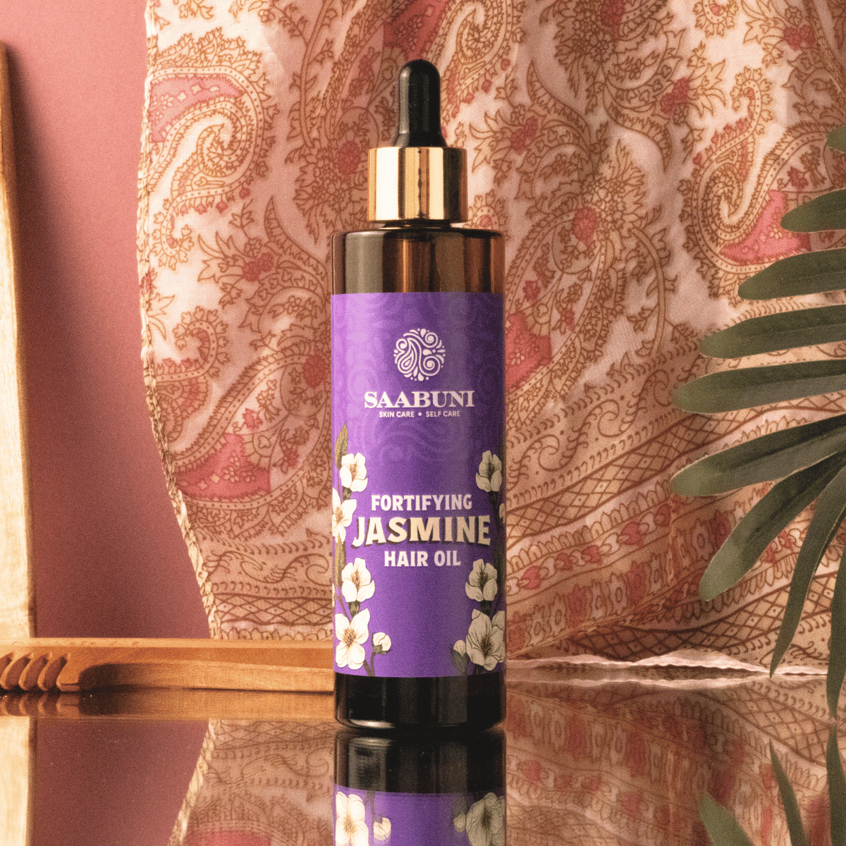 Jasmine Hair oil with paisley background