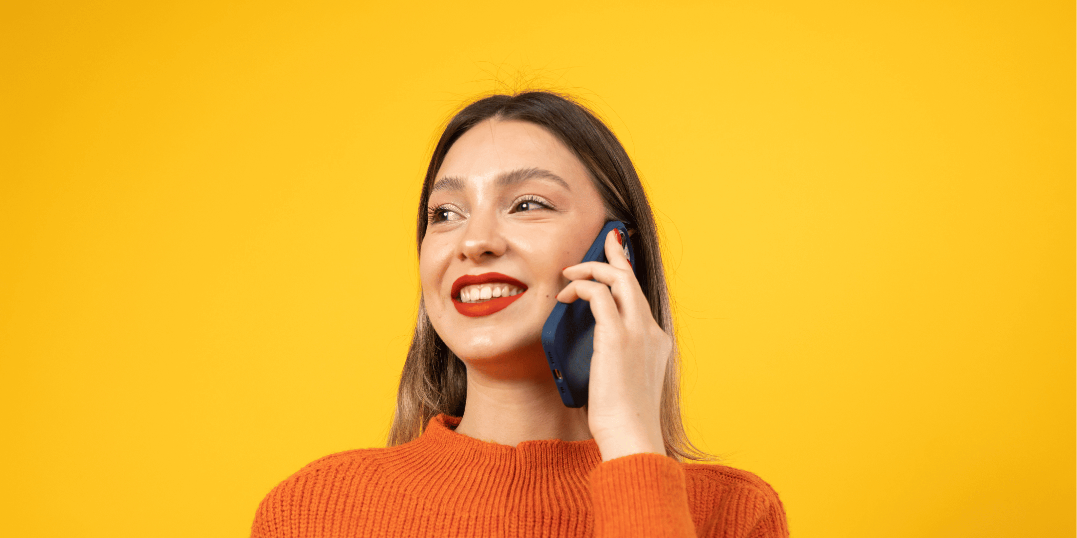 female on phone with yellow background