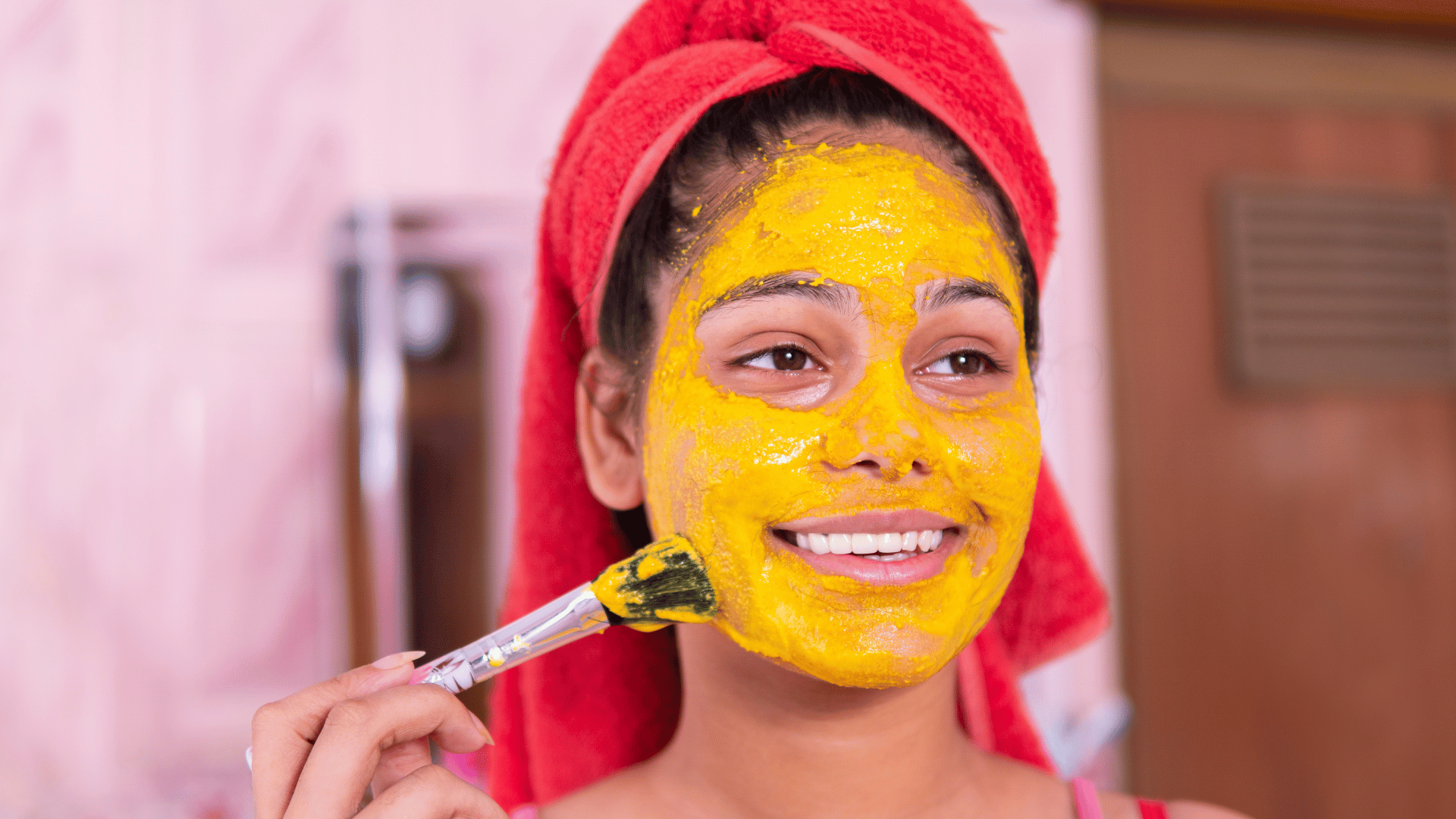 young woman with turmeric face mask
