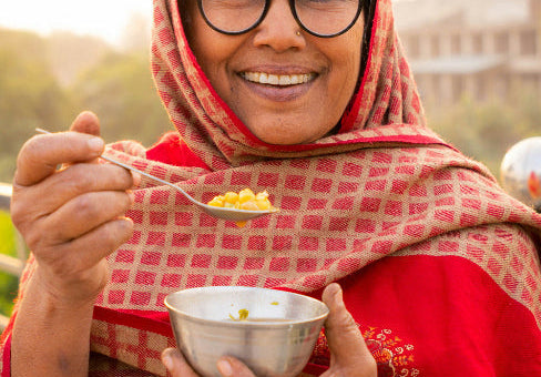 Indian Lady Eating Daal