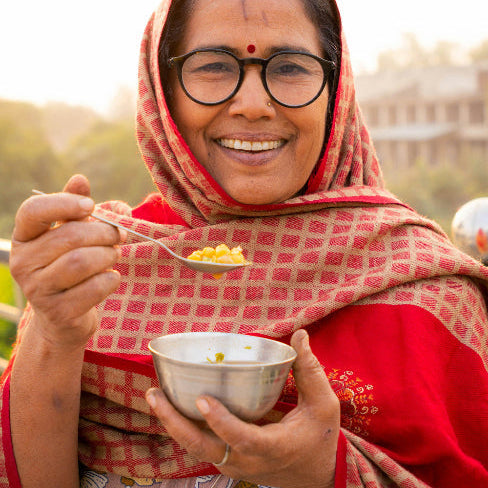 Indian Lady Eating Daal
