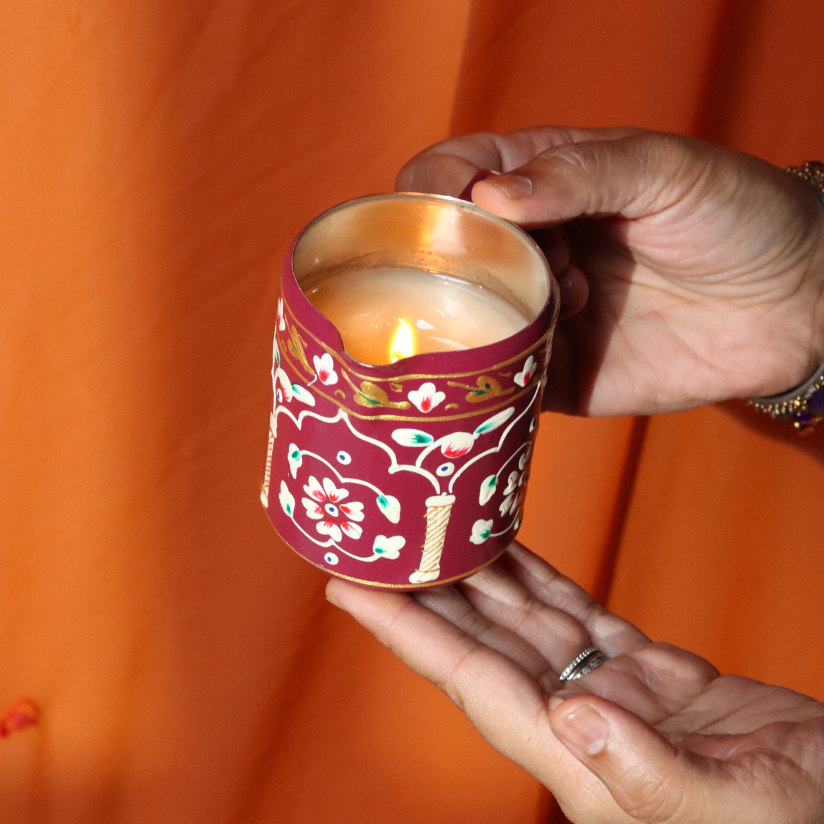 Woman holding decorative candle