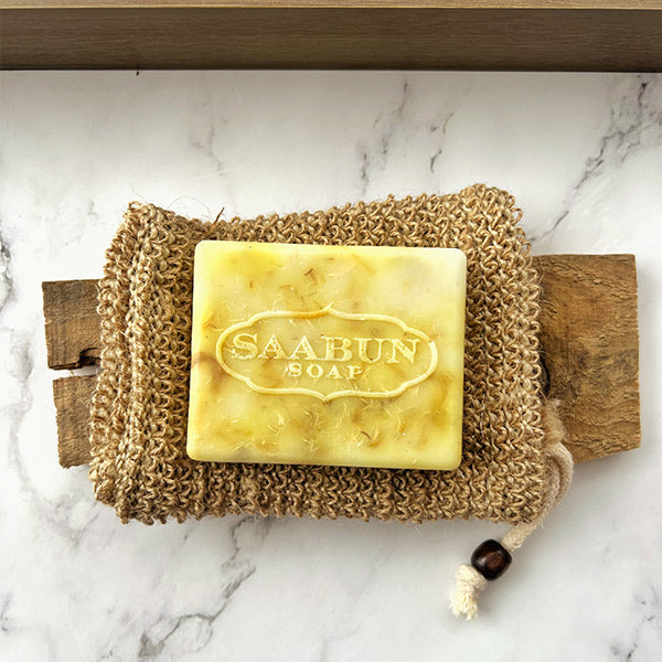 Exfoliating bag with soap on top