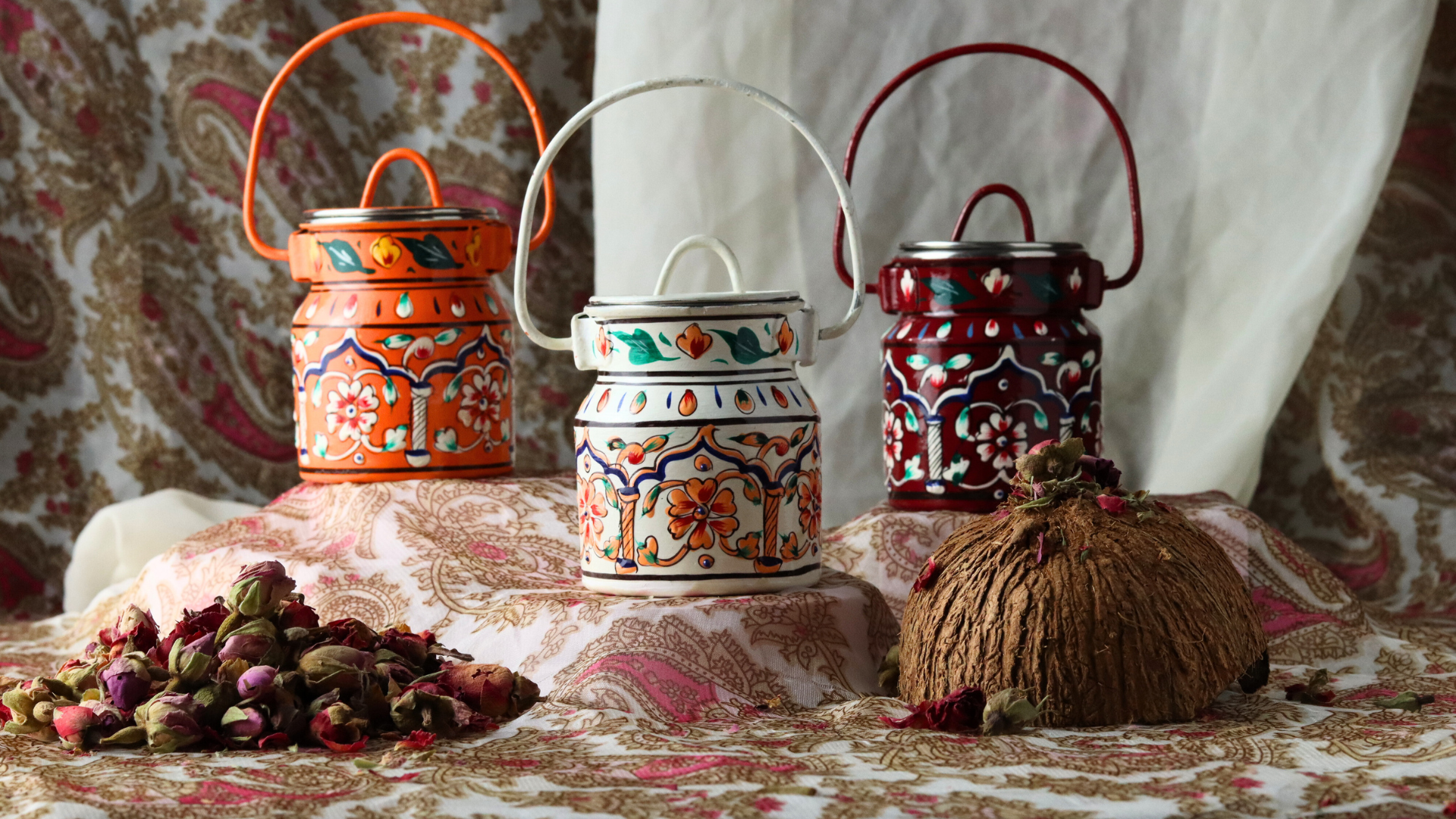 Decorative Milk Churns on patterned fabric