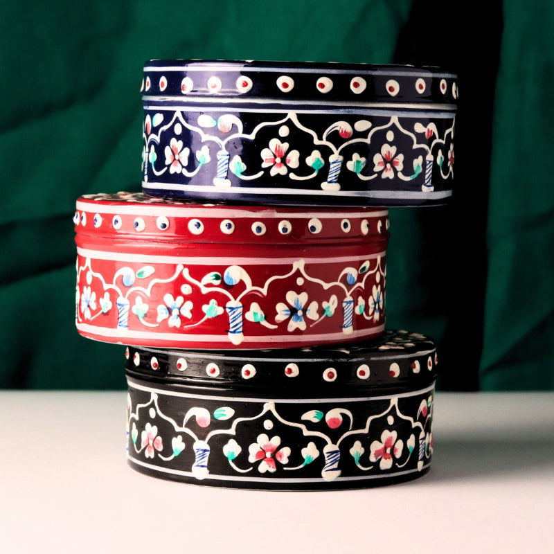 Body butter jars on green background