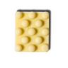 Rectangular bar of soap with raised circular nodules on a white background