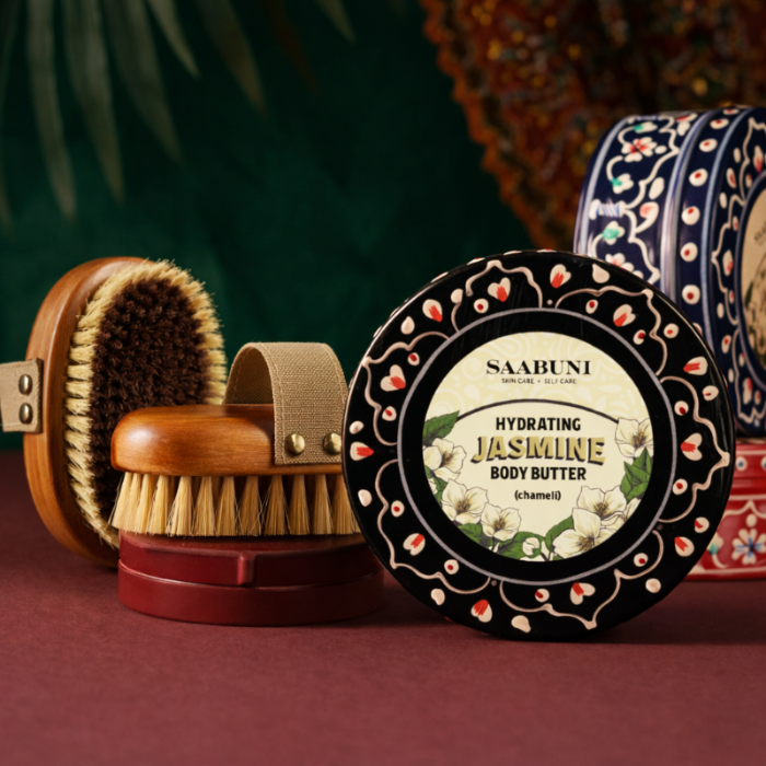 Body Brush and Jasmine Body Butter on colourful background