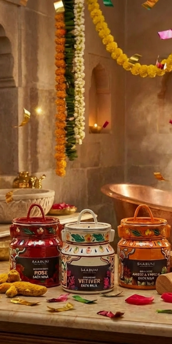 Sandalwood, Vetiver, and other bath milks candles on a marble surface with decorative flowers and lights in the background.